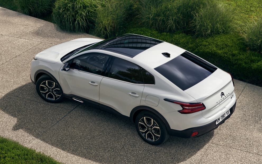 Top / side view of a white Citroen C4 X parked in a drive way