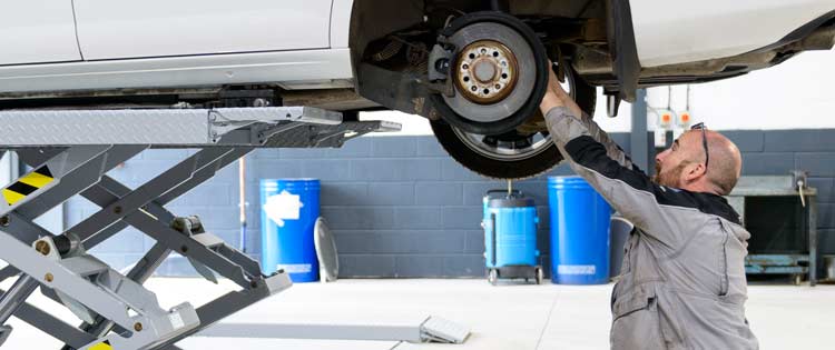 Arnold Clark technician servicing a car